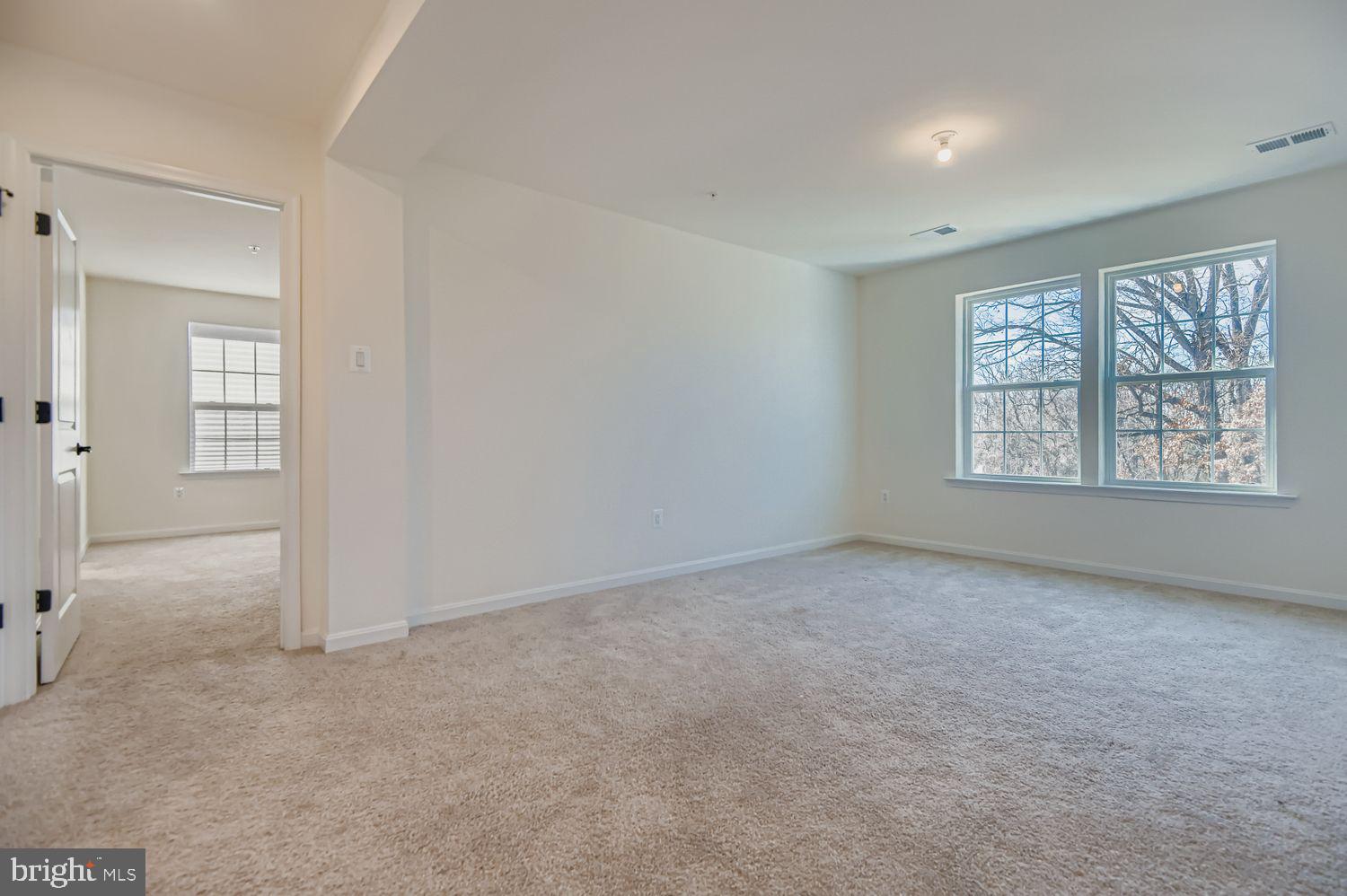 5708 Charlies Way White Marsh, MD 21162 - Photo 16 of 39 an empty room with windows and closet