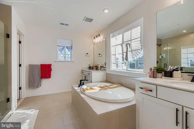 a bathroom with a glass shower door