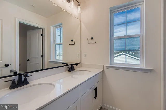 a view of an empty room and closet area