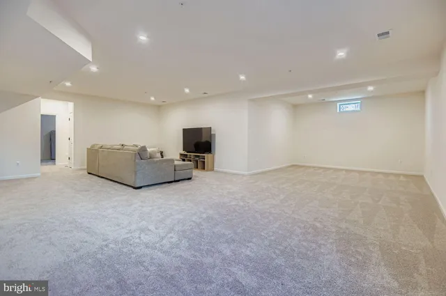a living room with furniture and a couch