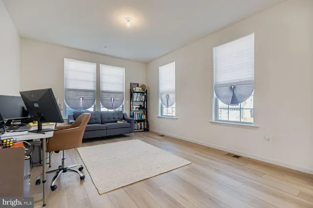 a workspace with furniture and a window