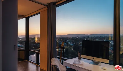 a view of balcony with furniture
