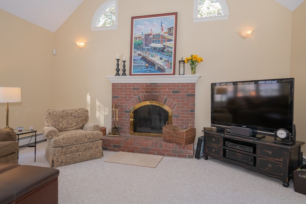 7 Round Table Road Shrewsbury, MA 01545 - Photo 11 of 39 a living room with furniture and a flat screen tv
