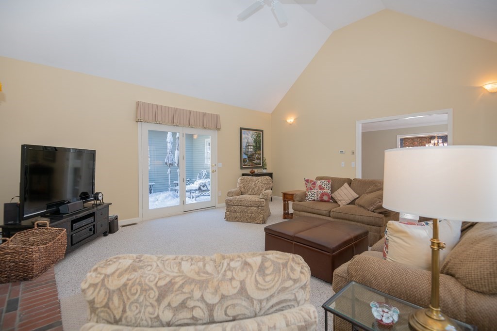 7 Round Table Road Shrewsbury, MA 01545 - Photo 12 of 39 a living room with furniture and a flat screen tv