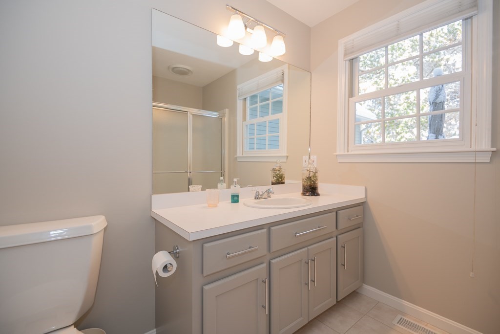 7 Round Table Road Shrewsbury, MA 01545 - Photo 17 of 39 a view of bathroom with a sink toilet and a mirror