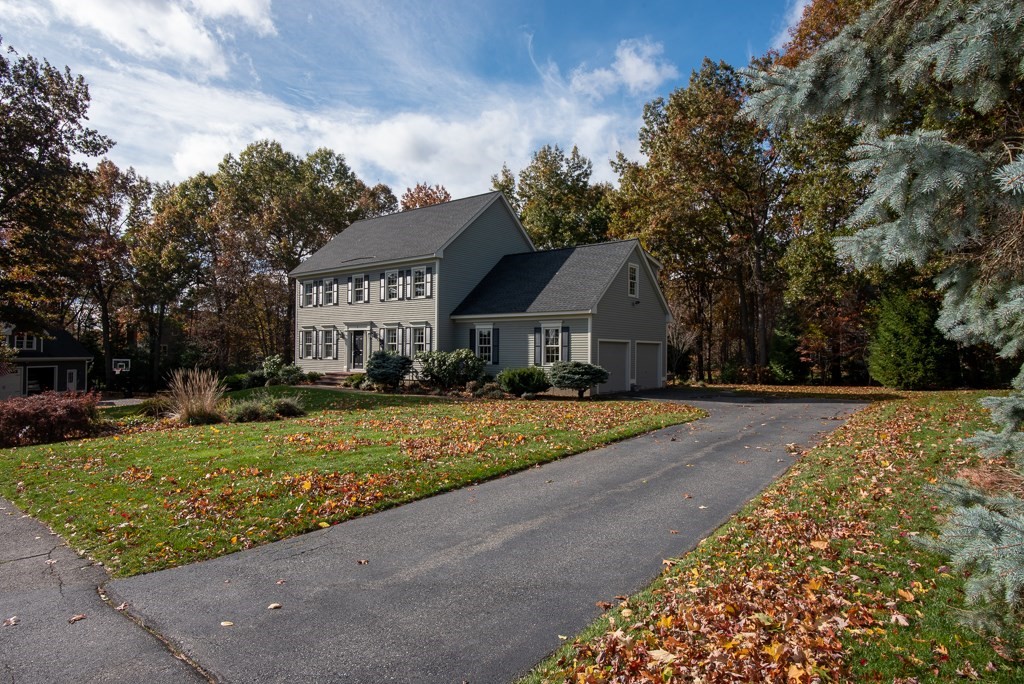 7 Round Table Road Shrewsbury, MA 01545 - Photo 2 of 39 a front view of a house with a yard