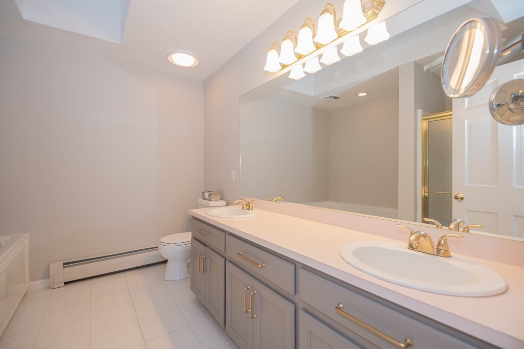 7 Round Table Road Shrewsbury, MA 01545 - Photo 22 of 39 a bathroom with a sink a toilet and a mirror