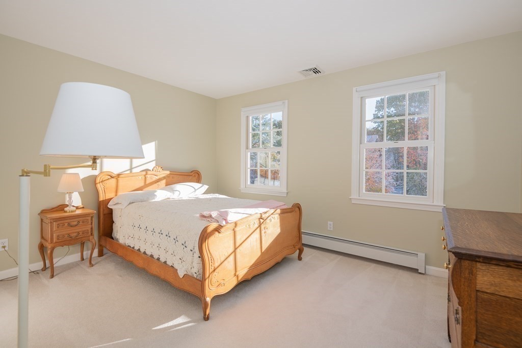 7 Round Table Road Shrewsbury, MA 01545 - Photo 24 of 39 a bed sitting in a bedroom next to a window