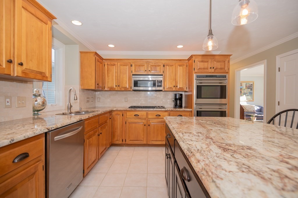 7 Round Table Road Shrewsbury, MA 01545 - Photo 4 of 39 a large kitchen with granite countertop a large counter top stainless steel appliances and cabinets