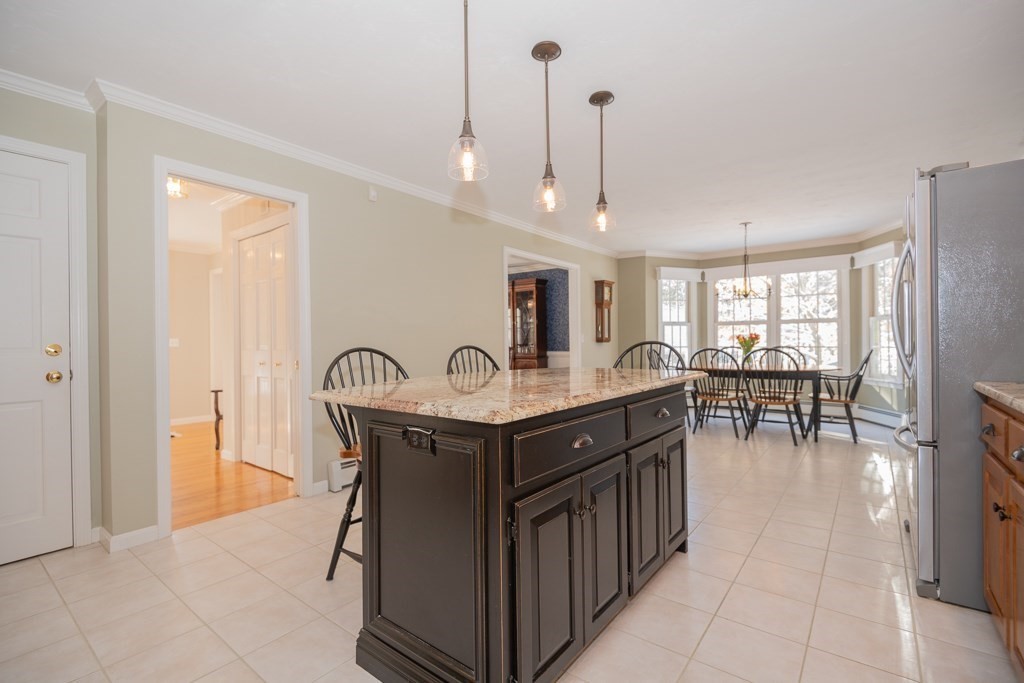 7 Round Table Road Shrewsbury, MA 01545 - Photo 6 of 39 a kitchen with stainless steel appliances granite countertop a stove and a refrigerator