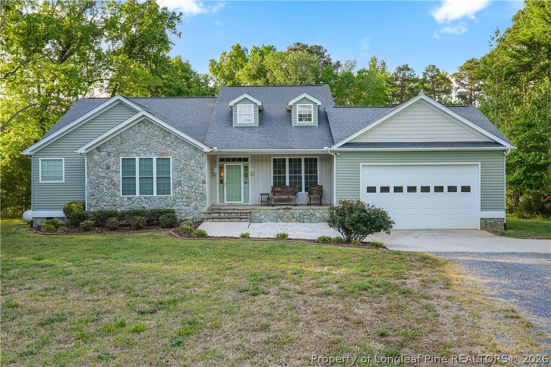 280 Hemp St Extension Robbins, NC 27325 - Photo 4 of 29 a house view with a garden space