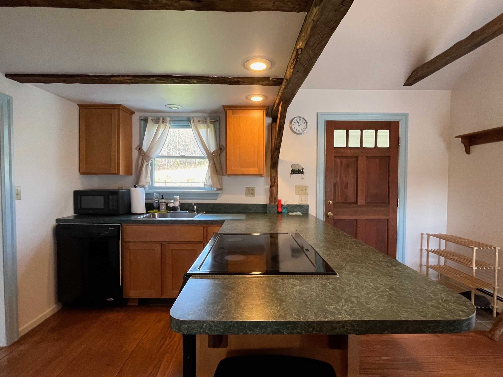 39 Haight Road North East, NY 12501 - Photo 5 of 11 a kitchen with a table chairs sink and cabinets