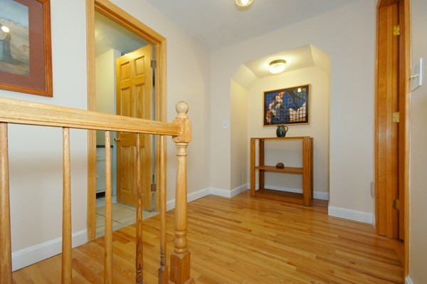 16 Depot Road Boxborough, MA 01719 - Photo 15 of 28 a view of a hallway with wooden floor and dining room