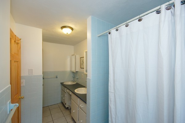 16 Depot Road Boxborough, MA 01719 - Photo 20 of 28 a bathroom with a sink and mirror