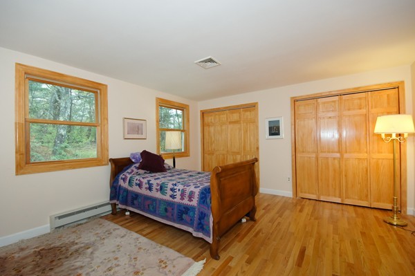 16 Depot Road Boxborough, MA 01719 - Photo 21 of 28 a bedroom with a bed and wooden floor