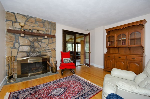 16 Depot Road Boxborough, MA 01719 - Photo 4 of 28 a living room with furniture a rug and a fireplace