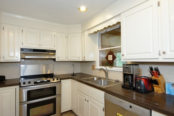 16 Depot Road Boxborough, MA 01719 - Photo 5 of 28 a kitchen with stainless steel appliances granite countertop a sink stove and cabinets