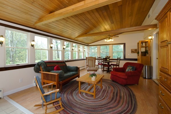 16 Depot Road Boxborough, MA 01719 - Photo 8 of 28 a living room with furniture and a floor to ceiling window