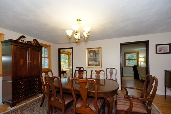 16 Depot Road Boxborough, MA 01719 - Photo 10 of 28 a view of a dining room with furniture and chandelier