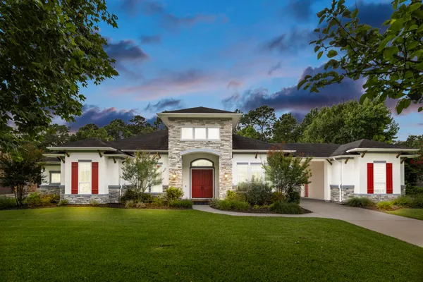 a front view of a house with a yard