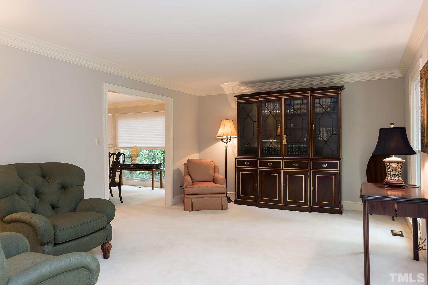 2301 Valley Forge Road Raleigh, NC 27615 - Photo 10 of 21 a living room with furniture a flat screen tv and a window