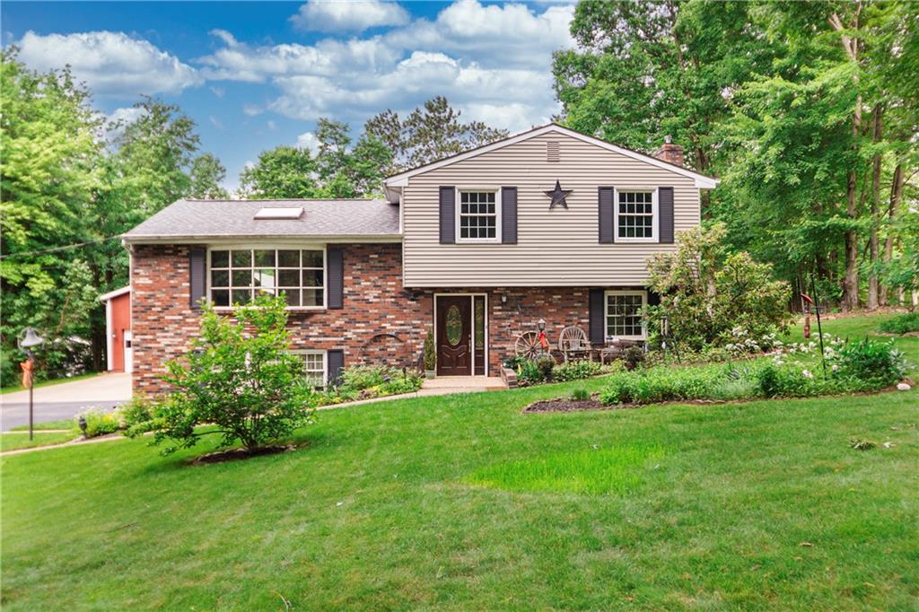110 Lovi Road Baden, PA 15005 - Photo 1 of 33 a front view of a house with a garden