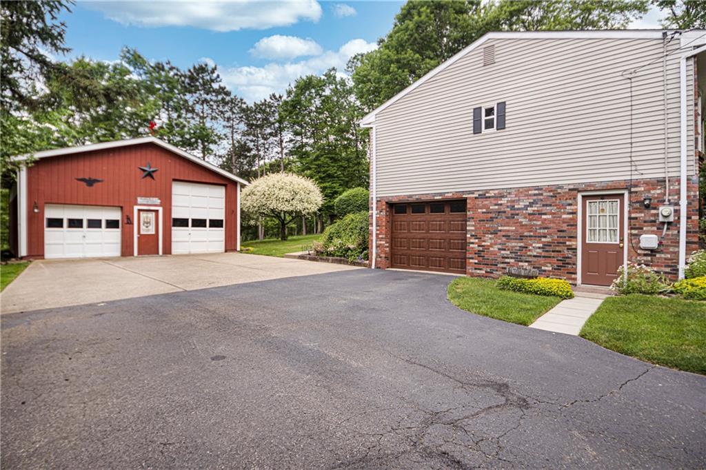 110 Lovi Road Baden, PA 15005 - Photo 2 of 33 a view of a house with a yard and garage