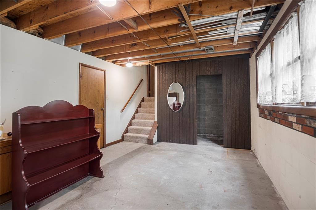 110 Lovi Road Baden, PA 15005 - Photo 22 of 33 a view of a hallway with wooden floor and staircase
