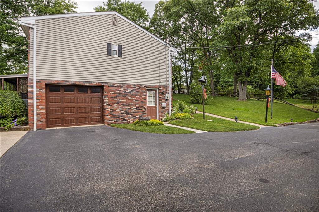 110 Lovi Road Baden, PA 15005 - Photo 27 of 33 a view of a house with a yard and garage