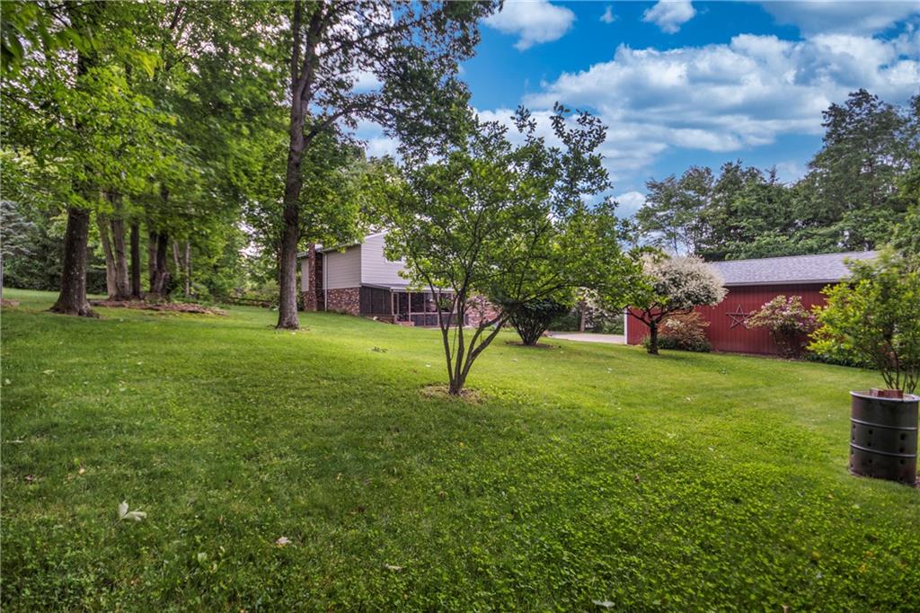 110 Lovi Road Baden, PA 15005 - Photo 29 of 33 a green field with lots of trees