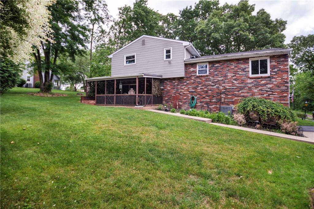 110 Lovi Road Baden, PA 15005 - Photo 30 of 33 a front view of a house with a garden