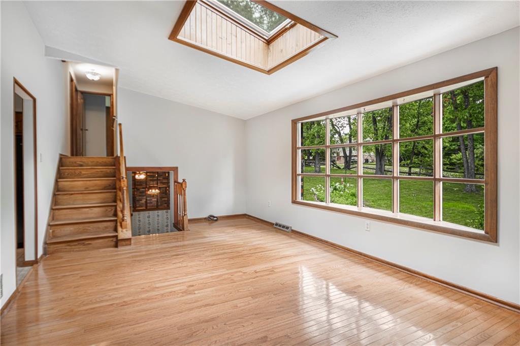110 Lovi Road Baden, PA 15005 - Photo 5 of 33 a view of an empty room with wooden floor and a window