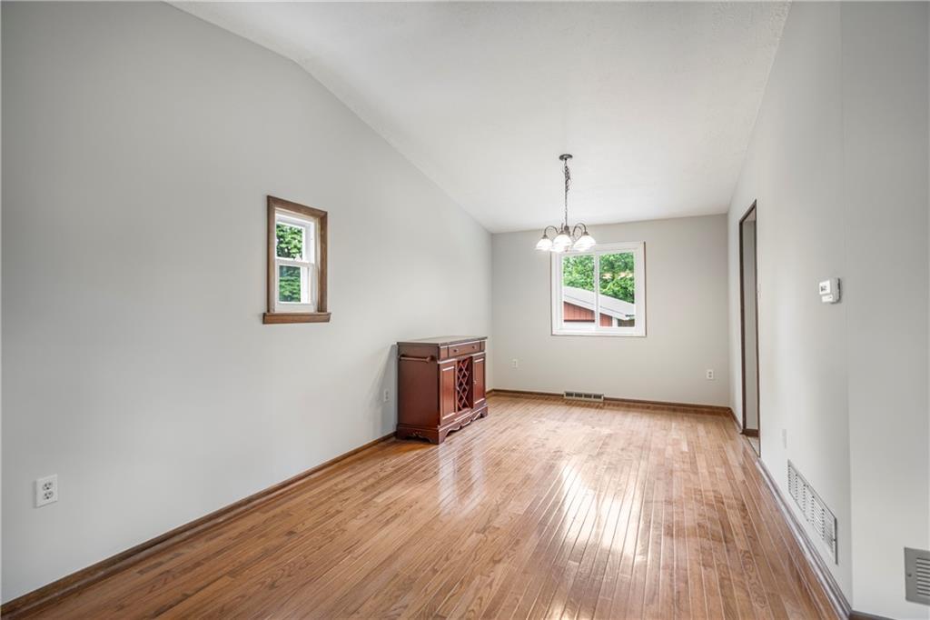 110 Lovi Road Baden, PA 15005 - Photo 6 of 33 wooden floor in an empty room with a window