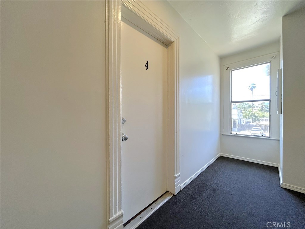 3449 4th Street, Unit 4 Riverside, CA 92501 - Photo 4 of 15 a view of an empty room with a window