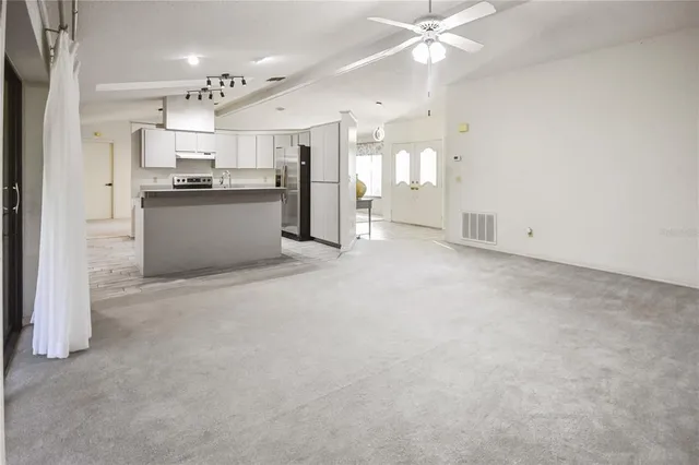 a view of an empty room with a window