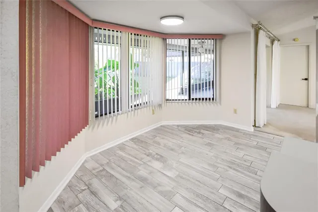 a view of an empty room with a window