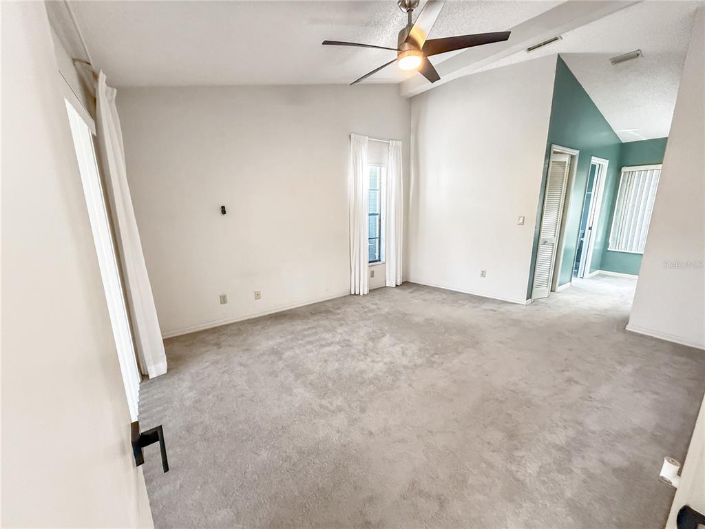 8143 Wooden Drive Spring Hill, FL 34606 - Photo 19 of 36 an empty room with windows
