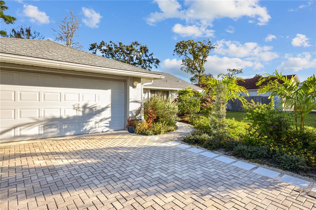 8143 Wooden Drive Spring Hill, FL 34606 - Photo 2 of 36 a view of a house with a garden