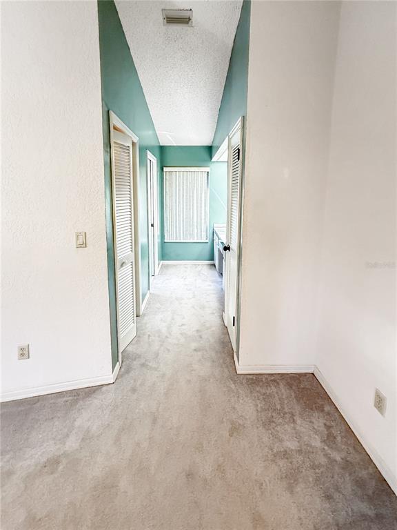 8143 Wooden Drive Spring Hill, FL 34606 - Photo 21 of 36 a view of a room with a hallway