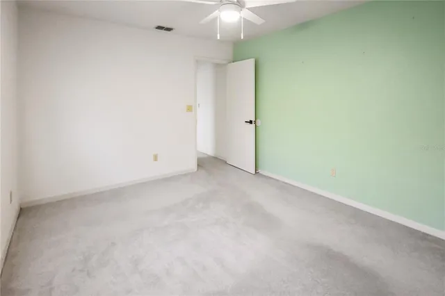 a bathroom with a sink a toilet and large mirror