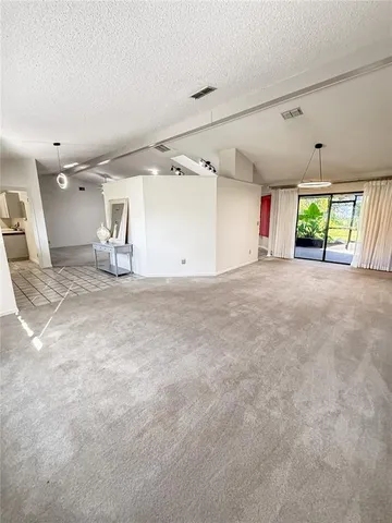 a room with wooden floor washer and dryer