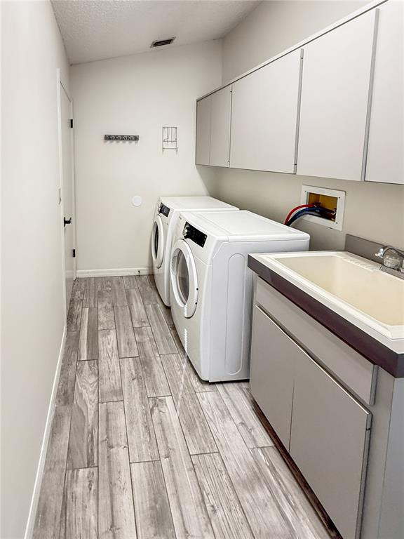 8143 Wooden Drive Spring Hill, FL 34606 - Photo 10 of 36 a utility room with dryer and washer