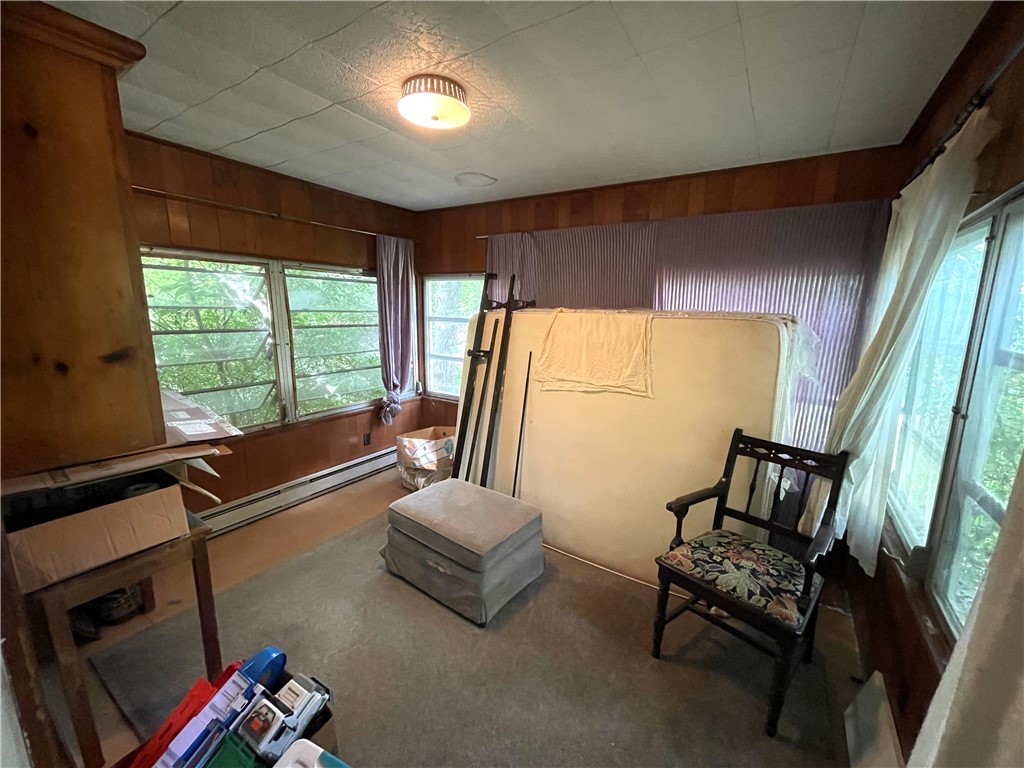 16 Overhill Road Warren, RI 02885 - Photo 29 of 49 Located of the side of living room is a 10x11 room that overlooks the large back yard.