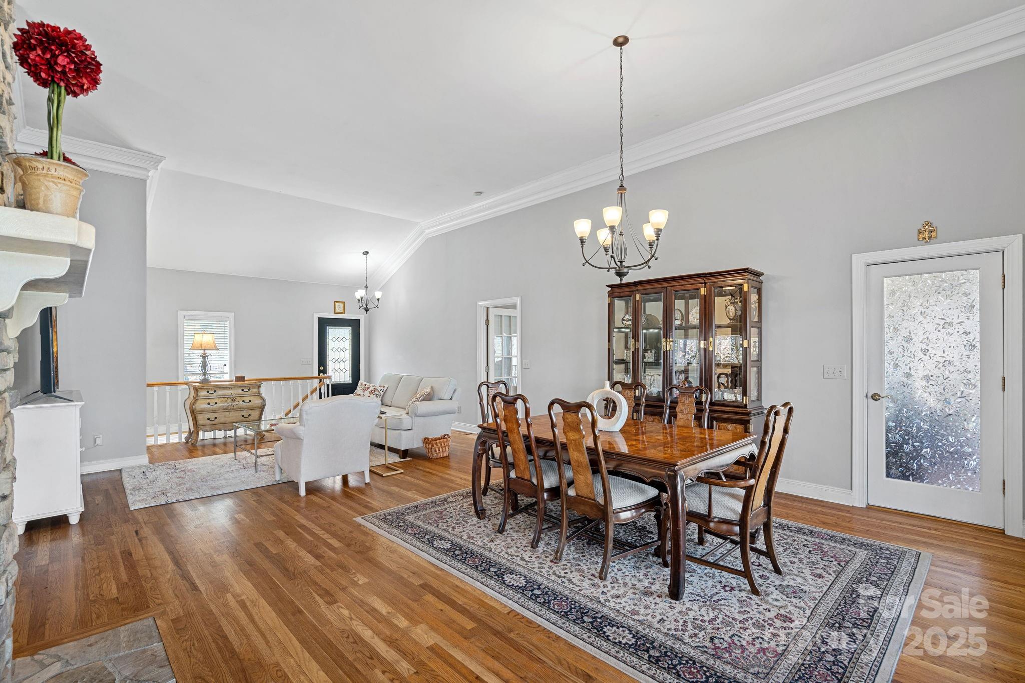 213 Patternote Road Mooresville, NC 28117 - Photo 11 of 48 a view of a dining room with furniture window and wooden floor