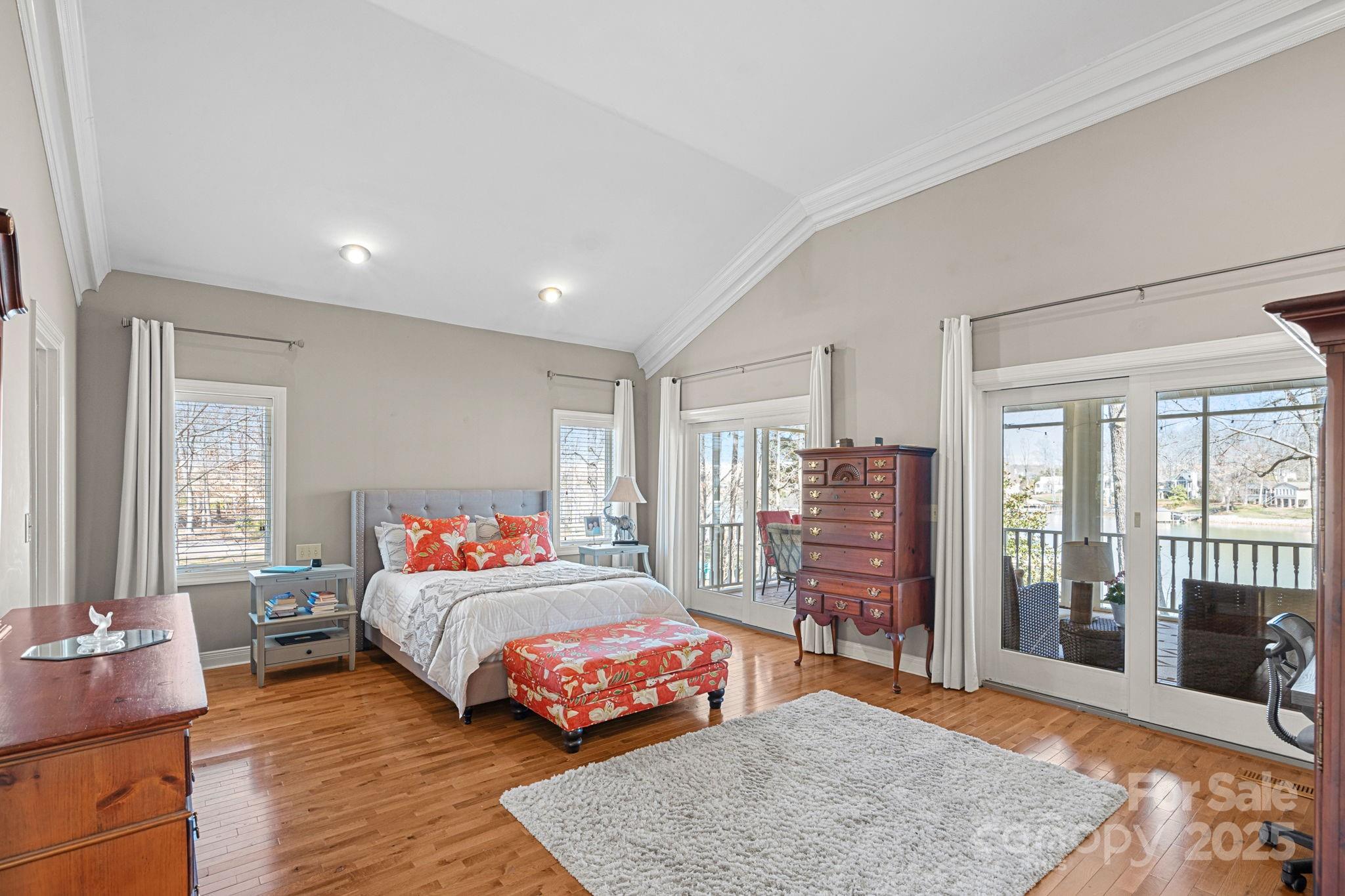 213 Patternote Road Mooresville, NC 28117 - Photo 23 of 48 a bedroom with a bed and wooden floor