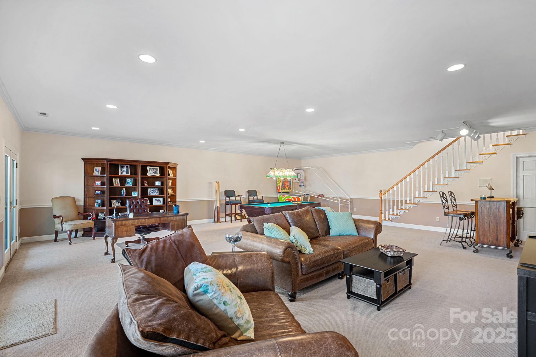 213 Patternote Road Mooresville, NC 28117 - Photo 31 of 48 a living room with furniture and wooden floor
