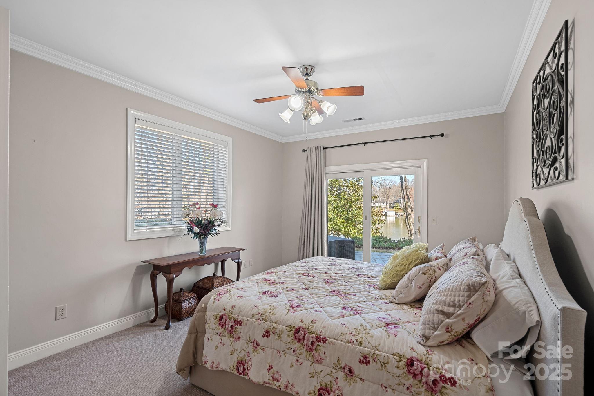 213 Patternote Road Mooresville, NC 28117 - Photo 35 of 48 a bedroom with a bed and a table