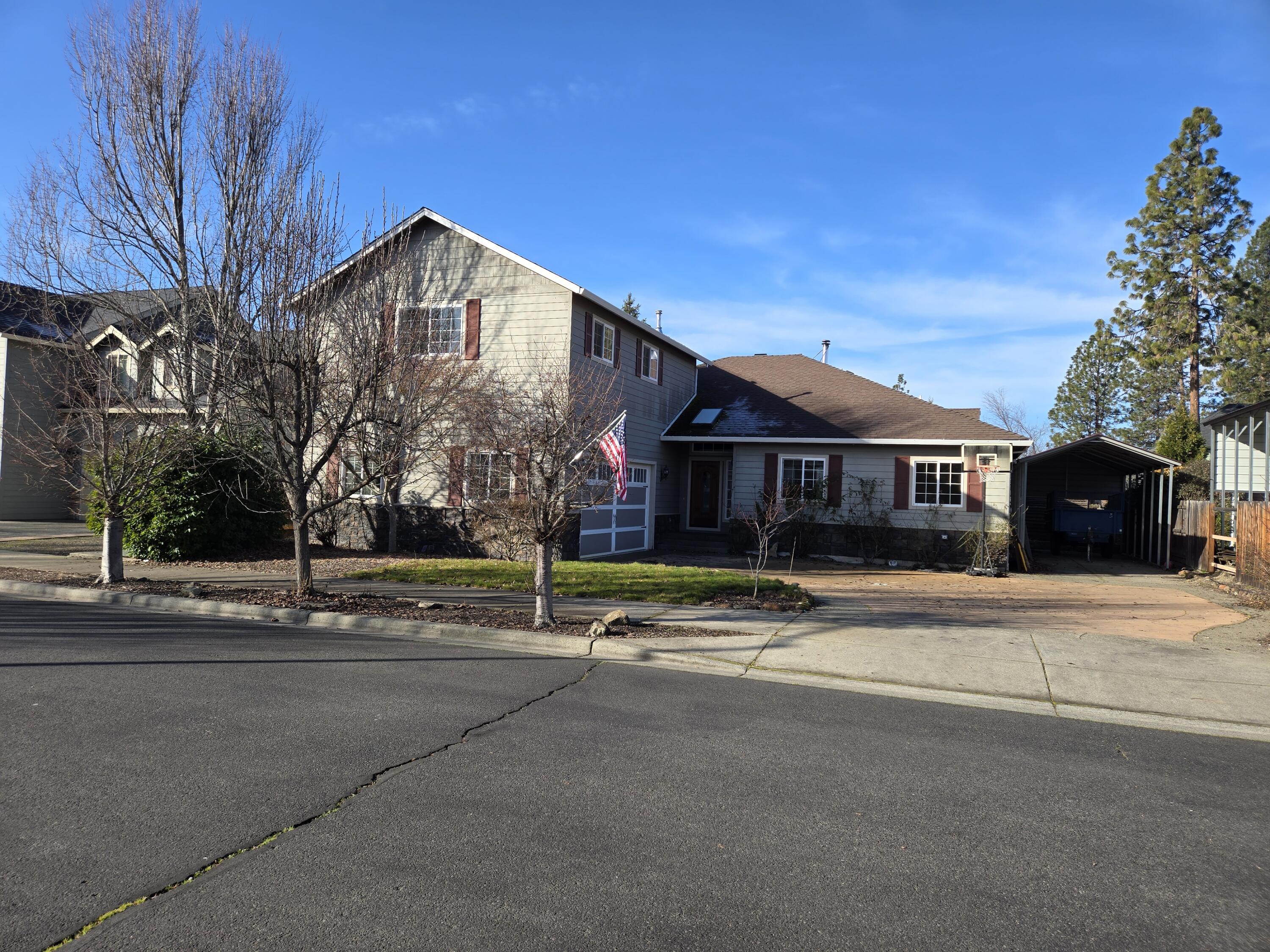 16 Portabello Way Eagle Point, OR 97524 - Photo 2 of 43 a front view of a house with a garden