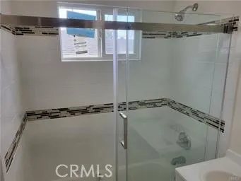 a bathroom with a shower and a shower