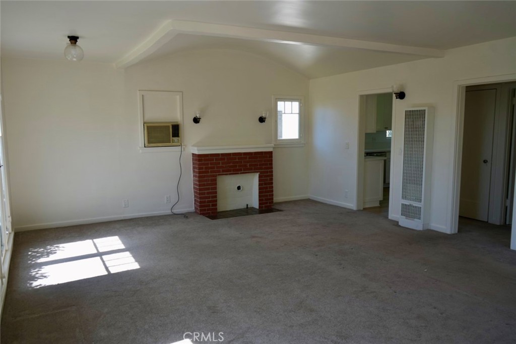 2117 Verde Street Pasadena, CA 91107 - Photo 3 of 13 an empty room with fireplace and window